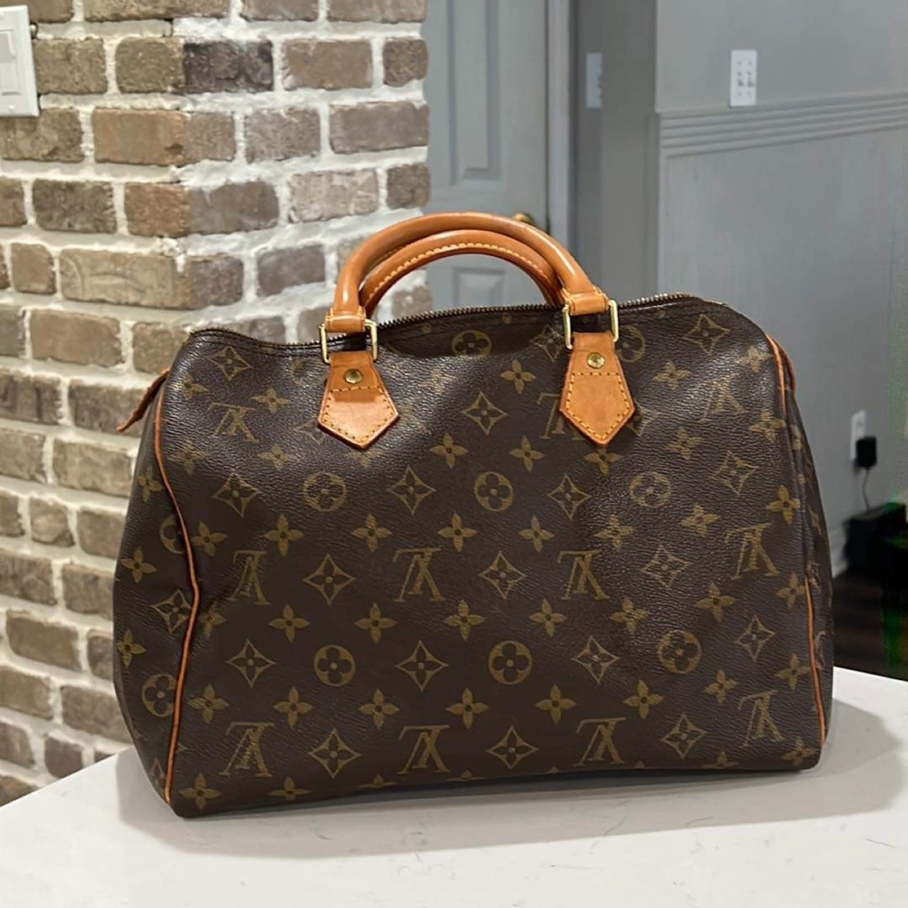 Great vintage LV Speedy. Good uses condition with a lot of life left.